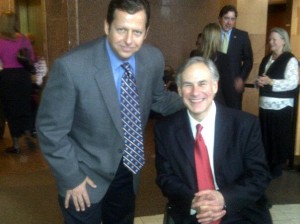 Backwards driver and profuse sweater Judge David Glickler with Gov. Greg Abbott